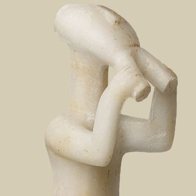 Marble statuette of a standing male figure playing a musical instrument (the double flute).
Keros, Early Cycladic II period (Keros-Syros Culture, 2800-2300 BC).