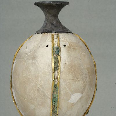 Ostrich-egg rhyton with silver aperture and decorative gold and copper bands around the body. Midea (Argolid), tholos tomb, 15th – 14th cent.