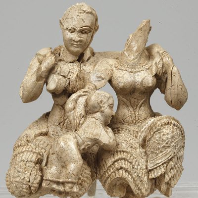 Ivory group figurine representing two seated female figures and a child. Mycenae acropolis, palace area. 15th- 14th cent. BC.
