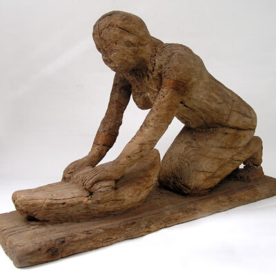 Statue of a kneeling woman kneading or grinding corn. Wood. Ancient Kingdom. Dynasty V (2465-2325 BC).  