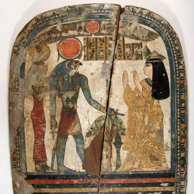 Funerary stelae of the female chanter of the god Amun, Taper(et), worshipping the god Re-Hor-akhty and a goddess (probably Isis). Wood. Third Intermediate Period. Dynasty XXII (945-722 BC). 