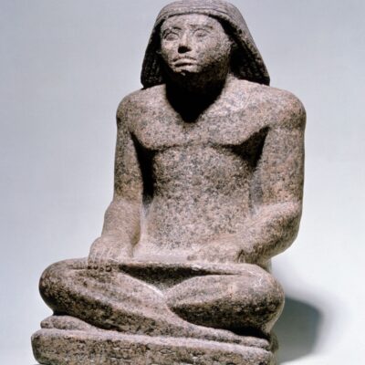 Statuette of the scribe Rahotep in a squatting pose. Granite. Ancient Kingdom. Dynasty V (2465-2325 BC).